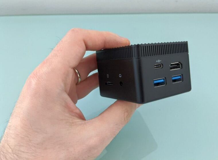 How to choose the perfect Mini PC and not regret it? Compact computer in a person's hand