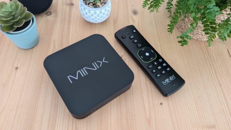 MINIX U8K-Ultra with remote control on a wooden table