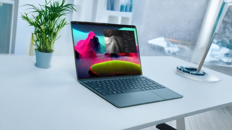 Image of Lenovo Yoga Slim 9i on a white table with colorful wallpaper on the screen