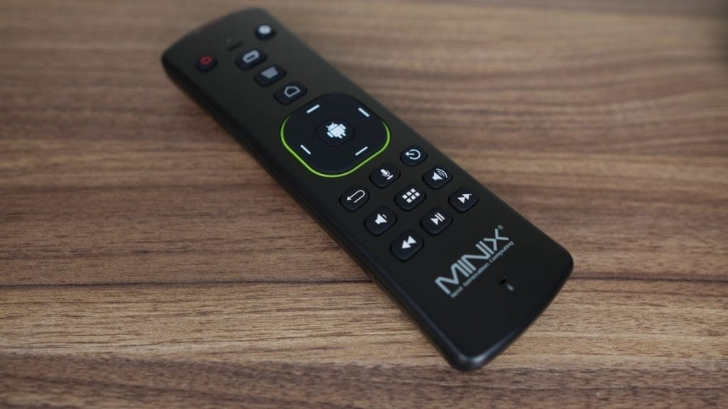 MINIX U8K-Ultra remote control on a wooden surface