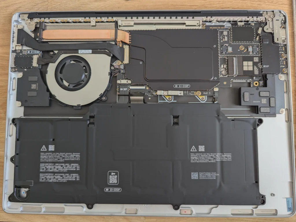 Internal components of the Surface Laptop 7, including the fan and battery